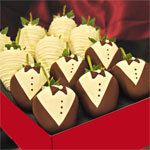 bride and tuxed dressed groom chocolate covered strawberries