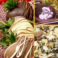Delivered gift of fancy chocolate covered strawberries with chocolate drizzled popcorn and nuts decorated with Santa Claus