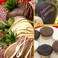 Delivered gift of fancy chocolate covered strawberries with  mini-cheesecakes decorated for the Holidays