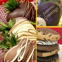 Delivered gift of fancy chocolate covered strawberries with chocolate dipped cookies decorated for the Holidays