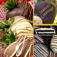 Delivered Holiday Seasons Greetings gift of chocolate covered strawberries with  oeros