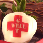 Chocolate covered strawberries that say Get Well
