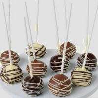 Cake pops dipped in chocolate and drizzled with more chocolate