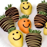 fresh hand dipped chocolate covered strawberries with happy smiles